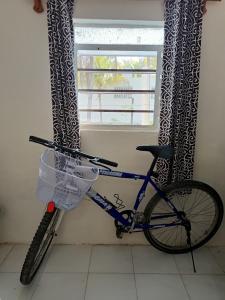 a bike parked in a room with a window at Cozy beachfront house Cocomar in San Crisanto +34 photos