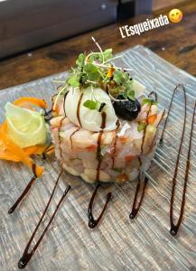 a piece of food on a glass plate at Hostal Cabrerès in Cantonigros