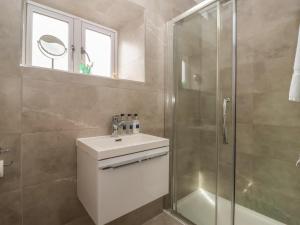 a bathroom with a sink and a shower at Shepherd's Crook in Harrogate +32 photos