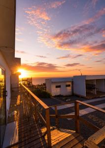 a view of the sunset from the deck of a house at Cabaña el Sol in La Boca