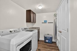 a laundry room with a washer and dryer in it at Moab RedCliff Condos in Moab +6 photos