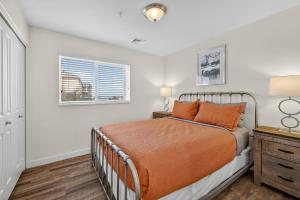 a bedroom with a bed and a window at Moab RedCliff Condos in Moab