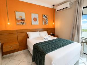 a hotel room with a bed and a window at Bella Vista Hotel in Barreirinhas