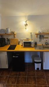 a kitchen with a counter with a microwave on it at Rezen Villas in Lorca