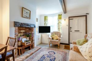 a living room with a fireplace and a tv at 2 Bed in Newark oc-o36894 in Newark-on-Trent