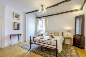 a bedroom with a bed and a table and a window at 2 Bed in Newark oc-o36894 in Newark-on-Trent