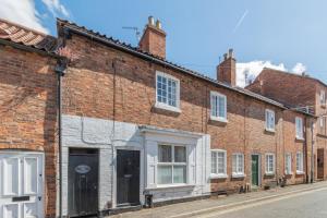 a row of brick buildings on a street at 2 Bed in Newark oc-o36894 in Newark-on-Trent