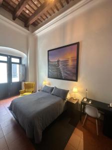 a bedroom with a large bed and a desk and a desk at 352 Boutique Guest House in San Juan +109 photos