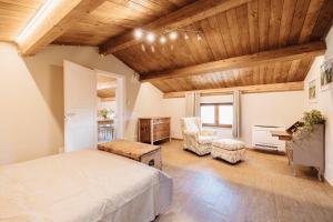 a bedroom with a bed and a desk in a room at Fattoria Il Bruco in Pila +76 photos