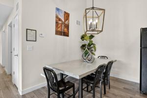 a dining room with a table and chairs at Moab Redcliff Condos in Moab +8 photos