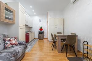 a living room with a table and a kitchen at My Tiny Home Venice in Marghera +14 photos