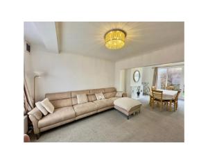 a living room with a couch and a table at Wunderschönes Chalet in Oberstdorf mit Berg in Oberstdorf