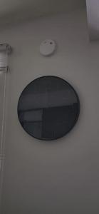 a clock on the ceiling of a room at D'Ponke Guest House in Cayey +2 photos