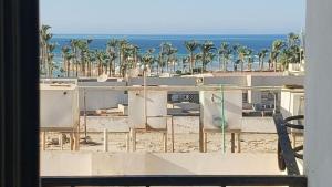 a view of the beach from a building at Hurghada Sea View Apartment in Hurghada