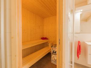 a sauna with a wooden bench in a room at Villa Milla - Nordhorn in Nordhorn