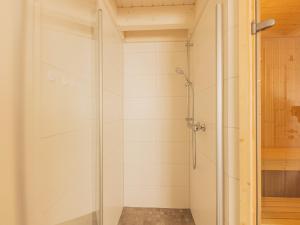 a shower with a glass door in a bathroom at Villa Milla - Nordhorn in Nordhorn +26 photos