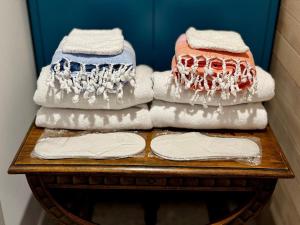 a pile of folded towels on a table at BluePrivateSpa in Latte +15 photos