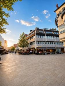 a city square with a large building in the middle at StadtBlick Hotel in Bad Salzuflen