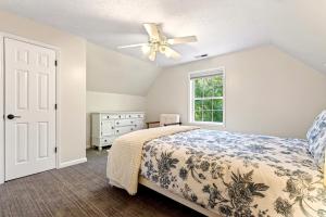 a bedroom with a bed and a ceiling fan at Calm Water Cove in Nebo