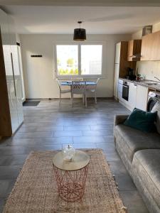 a living room with a couch and a table at Studio Redin in Savièse