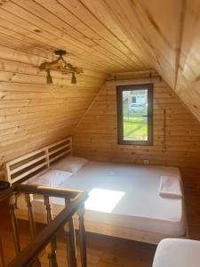 a room with a bed in a wooden cabin at Silent mode in Bijelo Polje +16 photos