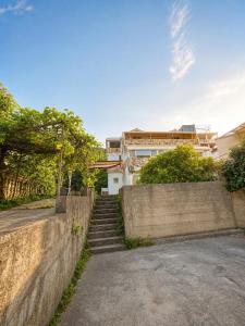 a set of stairs in front of a building at Central Nesst Budva in Budva +2 photos