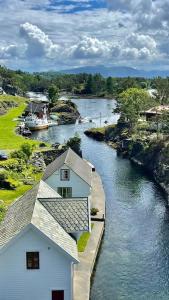 an aerial view of a river with a house at Bird Nest in Bømlo