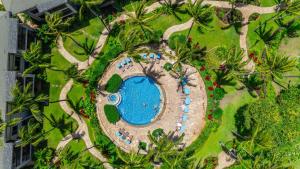 an overhead view of a swimming pool at a resort at Villa 105 at Turtle Bay in Kahuku +33 photos