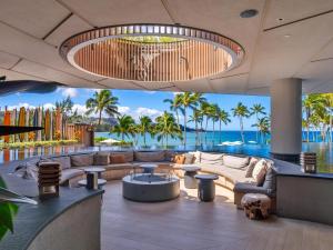 a living room with a view of the ocean at Villa 105 at Turtle Bay in Kahuku