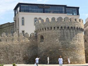 a building on top of a brick wall at Gala Terrace Hotel & Restaurant in Baku