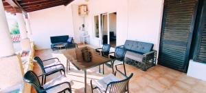 a patio with a table and chairs on a patio at Apartment Sofia in Kožino