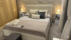 a bedroom with a large bed in a room at The Dream in Marina di Carrara
