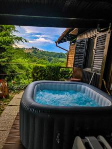 a hot tub in the backyard of a house at Kuća za odmor Štefi in Donji Koncovčak
