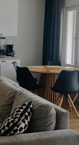 a living room with a table and two chairs at The Cozy Corner in Turku
