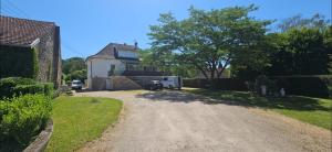 a dirt road in front of a house at hello dole in Dole