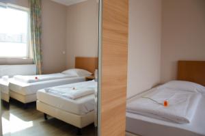Ein Bett oder Betten in einem Zimmer der Unterkunft Panorama Hotel Frankfurt Offenbach Süd