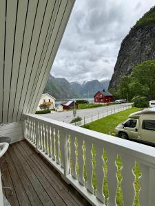 a balcony with a view of the mountains at Undredal Fjord Apartments in Undredal