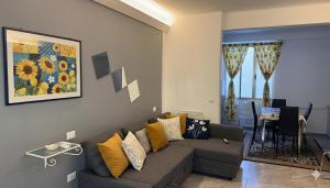 a living room with a couch and a table at The Dream in Marina di Carrara