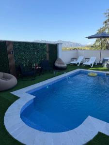 a swimming pool in the middle of a yard at Villa Mery Montserrat in Piera