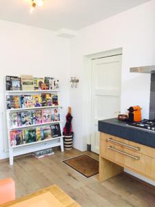 
a kitchen with a refrigerator and a sink at Independent Apartment Spaarne in Haarlem
