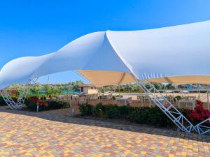 a large white tent on top of a patio at Promenad San in Dobrovelychkivka