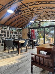 a dining room with a table and chairs in a room at Rancho by HV in Sevan
