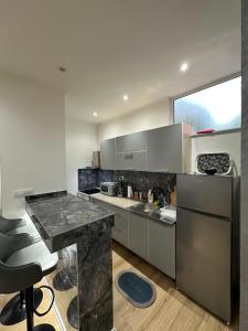 a kitchen with stainless steel appliances and a counter at MiR in Stolac