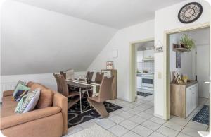 a living room with a table and a dining room at Kahler Pőn in Willingen