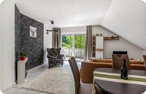 a living room with a couch and a table at Kahler Pőn in Willingen
