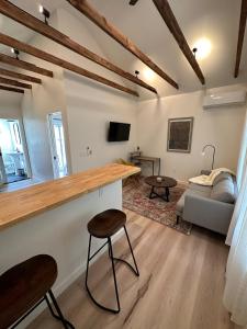 a living room with a counter and a couch at Modern cabin retreat in Catskill