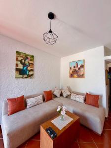a living room with two couches and a coffee table at Résidence Mdiq marsa - maison de vacances in M'diq