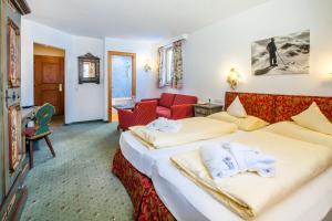 Postel nebo postele na pokoji v ubytování Hotel Anemone
