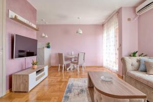 a living room with a couch and a table at V&V apartment in Podgorica