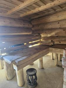 a wooden bench sitting inside of a building at Eco Retreat Saunahaus in Putgarten +1 photo